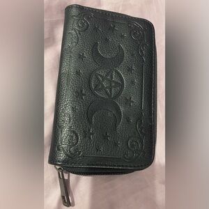 wallet with pentagram zippered closure an one change zippered pocket